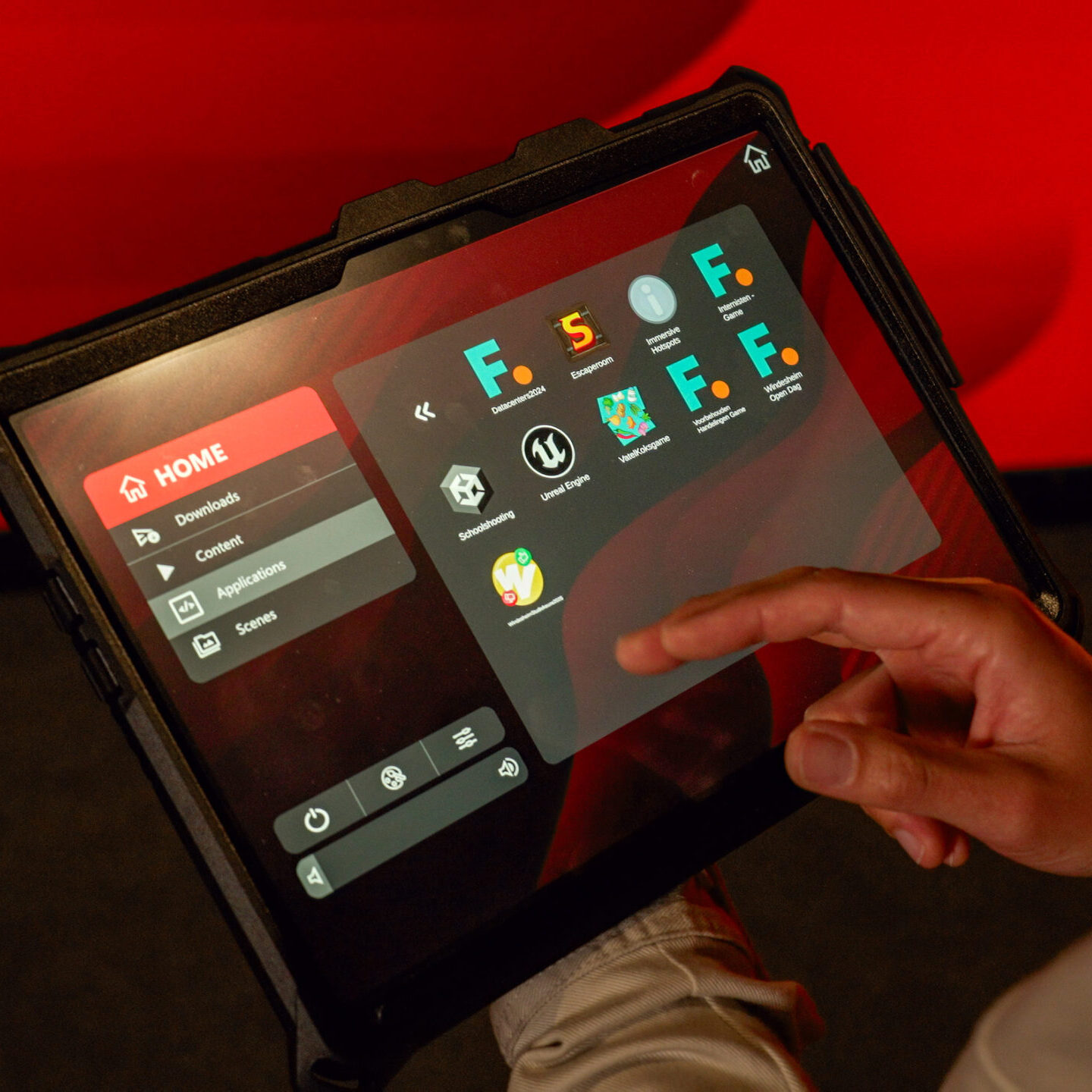 User controlling an Immersive Room with the Immersive Suite software on a tablet