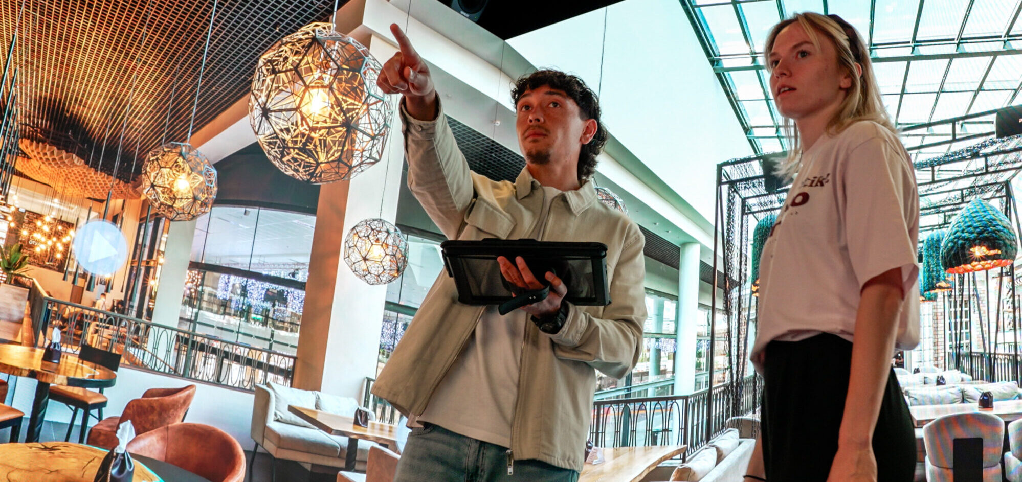 People exploring an immersive restaurant environment using interactive technology in an Immersive Room