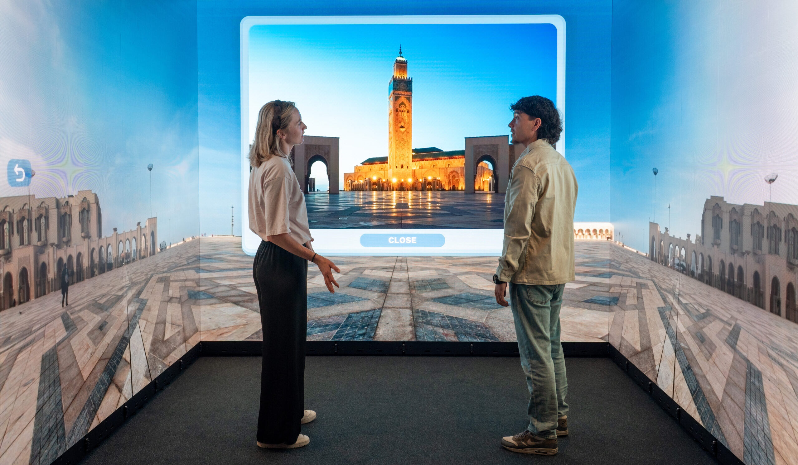 Visitors exploring the Hassan II Mosque in Casablanca through an interactive Immersive Room experience