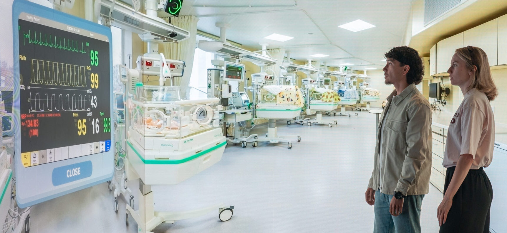 Visitors exploring an immersive hospital environment with interactive medical content in an Immersive Room